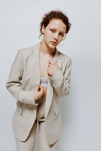 Businesswoman standing against white background