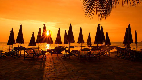 Panoramic view of beach against sky during sunset