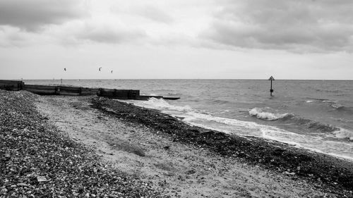 Scenic view of sea against cloudy sky