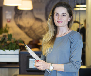 Portrait of smiling woman standing