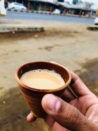 Person holding coffee cup