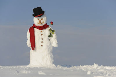 Funny snowman in snow