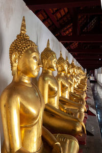 Buddha statue in temple outside building