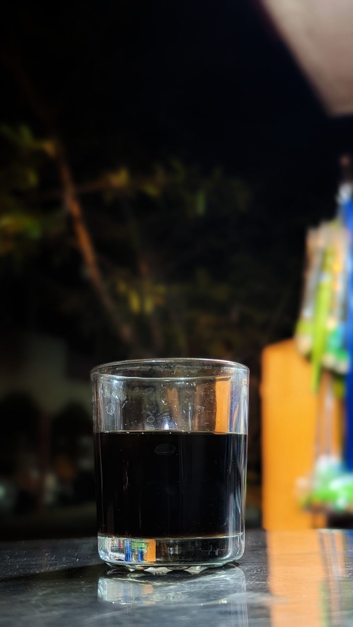 food and drink, glass, drink, drinking glass, household equipment, refreshment, soft drink, table, focus on foreground, water, alcohol, alcoholic beverage, no people, close-up, indoors, light, distilled beverage, freshness, still life, selective focus, reflection, food