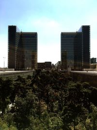 Buildings in city against sky