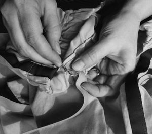 Close-up of hands stitching fabric