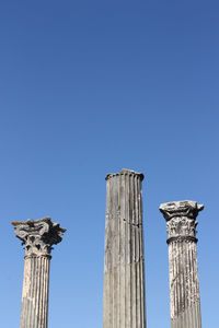 Low angle view of statue against blue sky