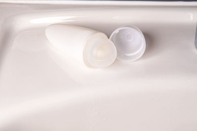 High angle view of bottle on white background