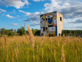 House on field against sky