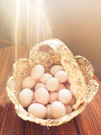 High angle view of eggs in basket on table