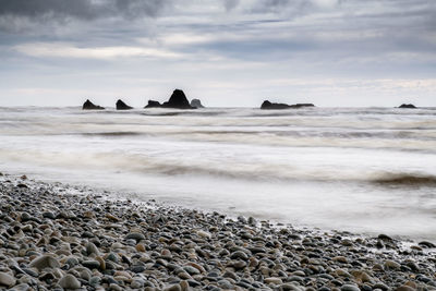 Scenic view of beach against sky