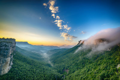 Scenic view of mountains against sky during sunset