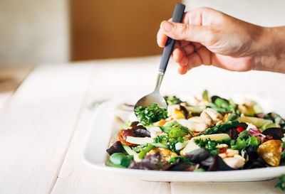 Cropped image of hand holding food