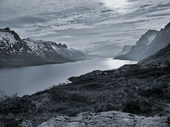 View of calm lake against mountain range