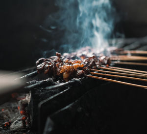 Close-up of food on barbecue grill