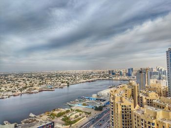 High angle view of buildings and city against sky