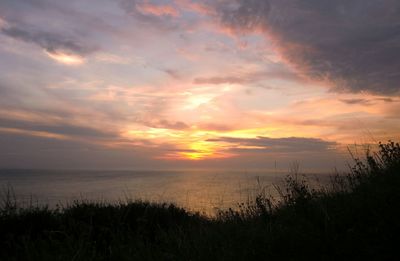 Scenic view of sea against sky during sunset