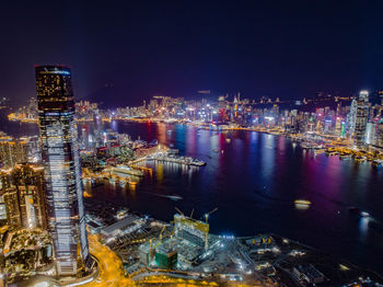 High angle view of illuminated city buildings at night