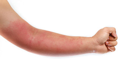 Midsection of person with hand on white background