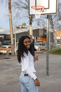 Portrait of teenage girl on basketball court