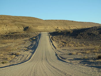 Scenic view of desert against clear sky