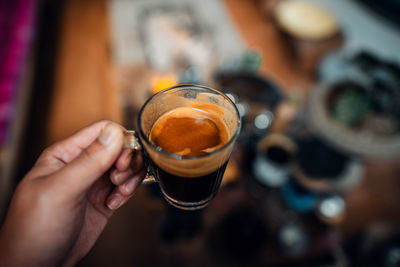 Cropped hand holding coffee