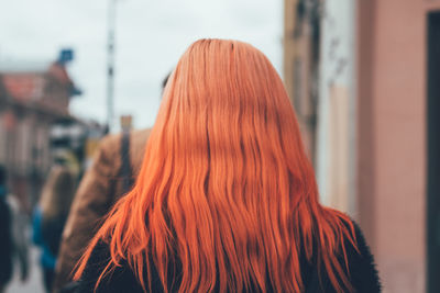 Rear view of young woman looking away