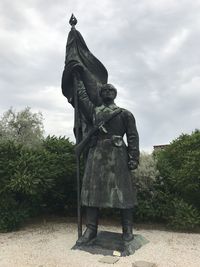 Low angle view of statue against sky