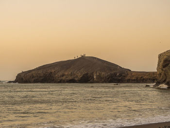 Scenic view of sea against clear sky during sunset