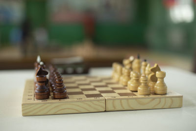 Close-up of chess pieces on table