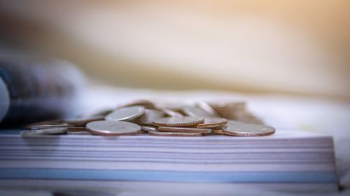 Close-up of coins on table