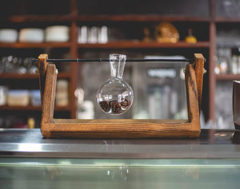 Close-up of glass bottles on table at store