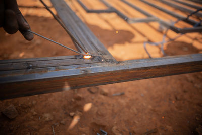 Zambian welder, welding , african man working with his hands 