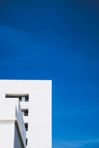 Low angle view of building against blue sky