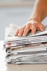 Cropped hand of man working on table