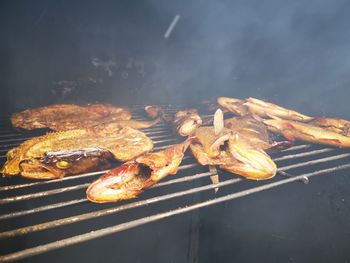 High angle view of meat on barbecue grill