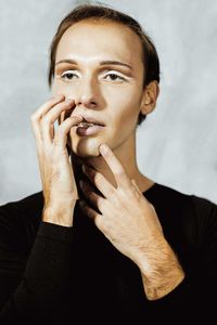 Close-up of man against white background