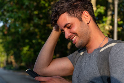 Portrait of young man using mobile phone