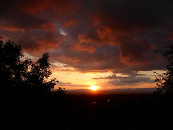 Scenic view of silhouette landscape against sky at sunset