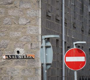 Close-up of information sign on wall