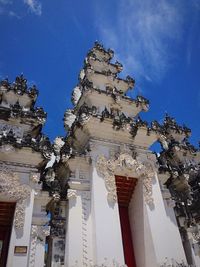 Low angle view of built structure against blue sky