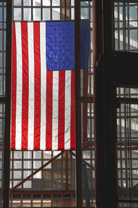 Close-up of flag against window