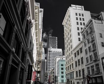 Low angle view of buildings in city against sky