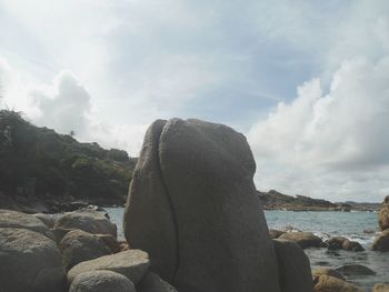 Woman on beach against sky