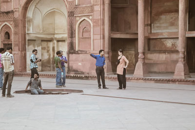 People walking in historic building