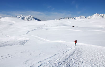 Man skiing on snow covered mountain