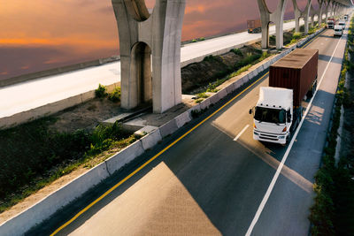 High angle view of vehicles on road against sky