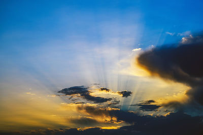 Low angle view of silhouette crane against sky during sunset