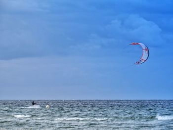 People surfing in sea