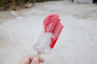 Hand holding ice cream cone